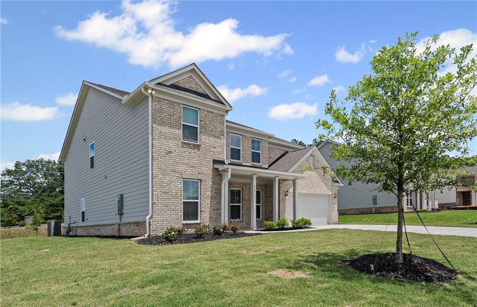 Front exterior of a new home in Anderson Point Estates, McDonough, GA, highlighting curb appeal (Image 2).