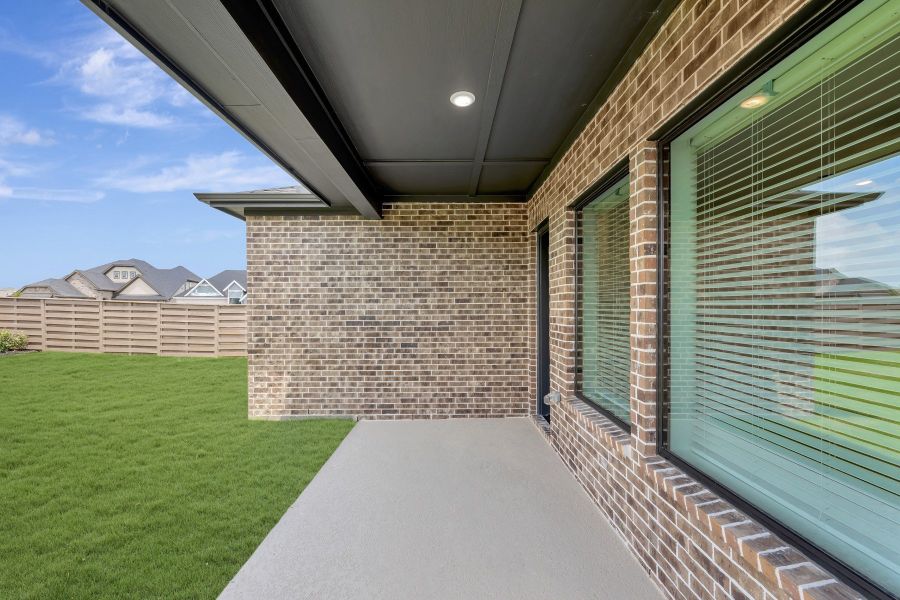 Exterior details and patio area of a home in Austin Point - Terrace Collection, Richmond (Image 4).