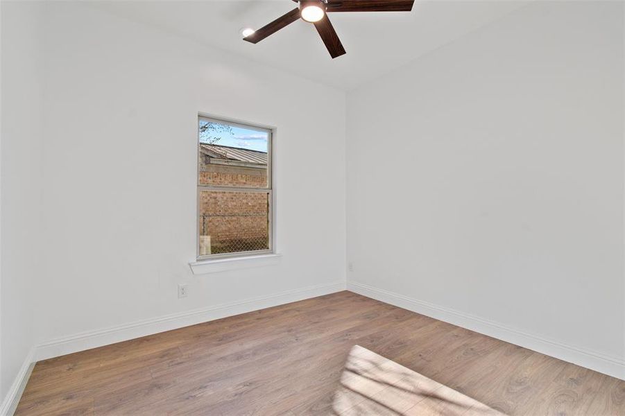 Spare room with ceiling fan and hardwood / wood-style floors