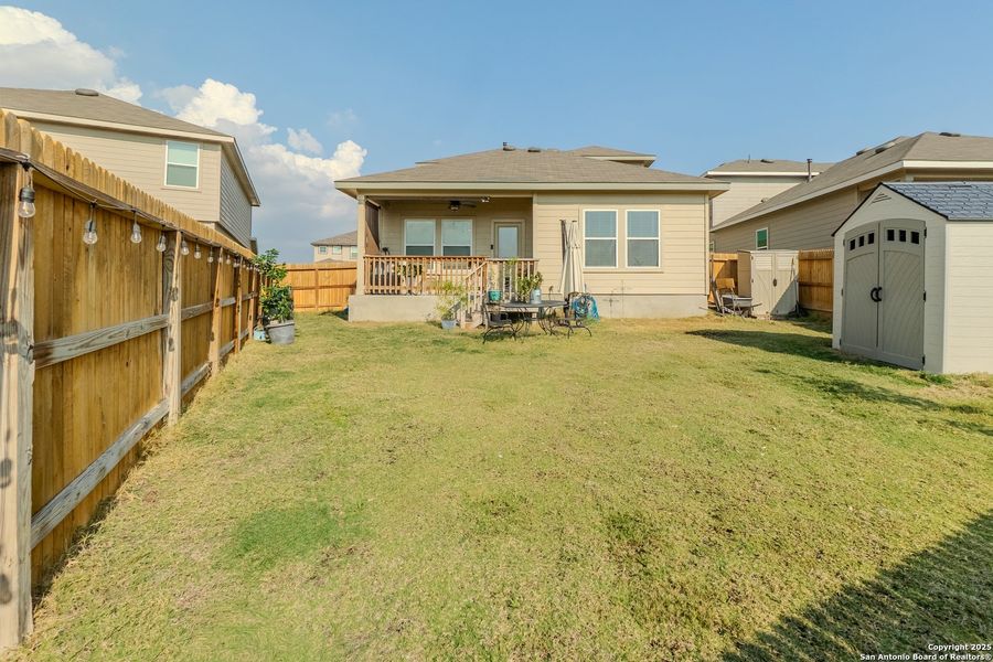 Exterior details and patio area of a home in The Links at River Bend, Floresville (Image 25).