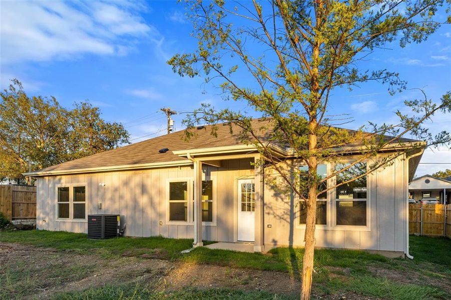 Rear view of property featuring board and batten siding