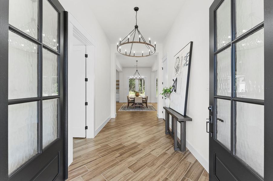 Step inside to soaring ceilings, wood accents, and an open, light-filled layout that immediately showcases the craftsmanship and luxury finishes throughout. Step inside to soaring ceilings, wood accents, and an open, light-filled layout that immediately showcases the craftsmanship and luxury finishes throughout.