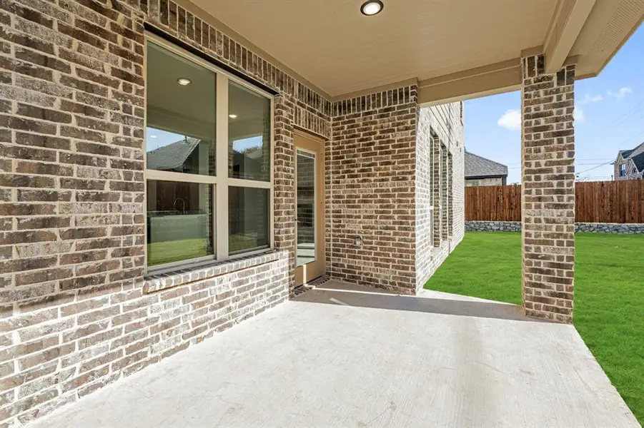 Exterior details and patio area of a home in Homestead at Daniel Farms, DeSoto (Image 4).