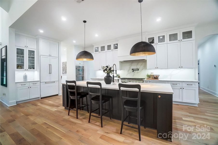 Gourmet kitchen with 10' quartz island