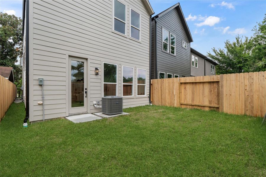 Private backyard with full fencing, green space, and direct access from the main living area. Private backyard with full fencing, green space, and direct access from the main living area.