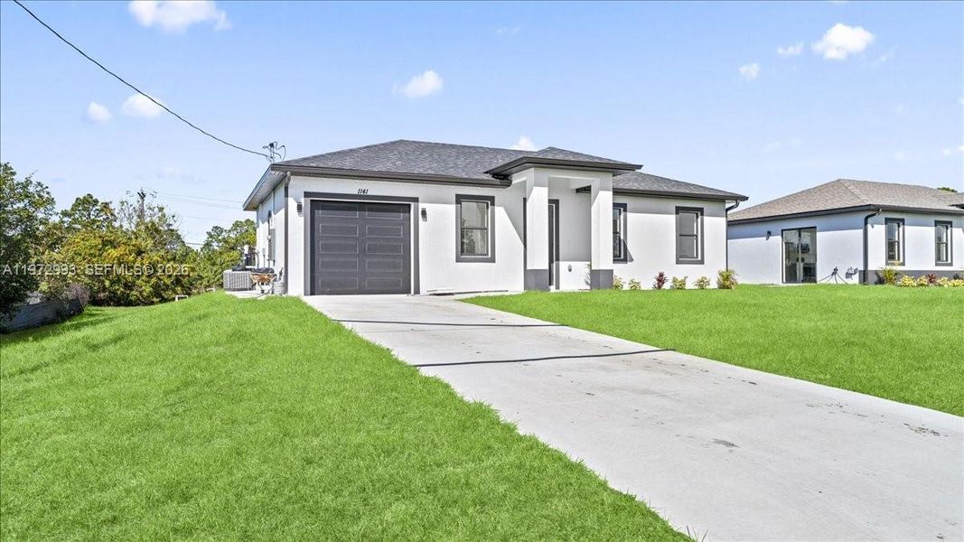 Front exterior of a new home in , Lehigh Acres, FL, highlighting curb appeal (Image 20).