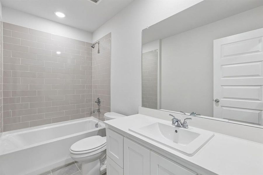 Bathroom in the Harrison home plan by Trophy Signature Homes – REPRESENTATIVE PHOTO