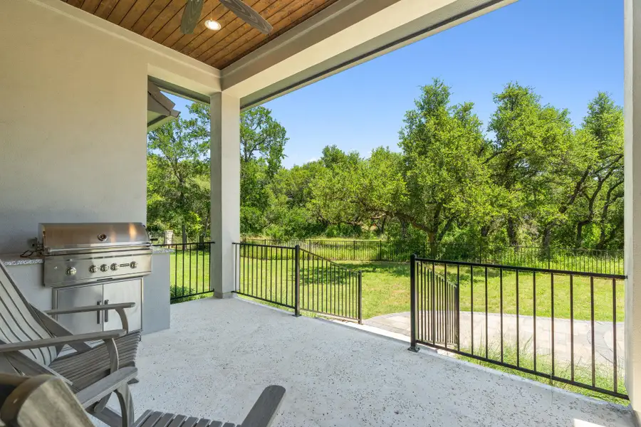 The covered patio overlooks a peaceful greenbelt with no rear neighbors behind the home. The covered patio overlooks a peaceful greenbelt with no rear neighbors behind the home.