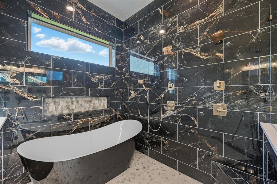 Full bath with tile walls and a freestanding bath Full bath with tile walls and a freestanding bath