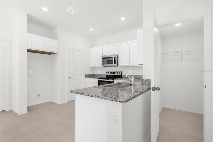 Furnished interior view inside a new home in Bellaviva III at Westside, Davenport (Image 10).
