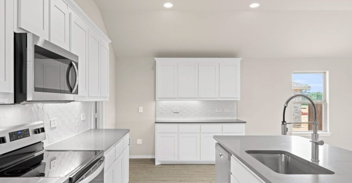 Representative exterior photo of a completed home built from the Lincoln by Impression Homes in Keeneland, Aubrey, TX (Image 7). Representative exterior photo of a completed home built from the Lincoln by Impression Homes in Keeneland, Aubrey, TX (Image 7).