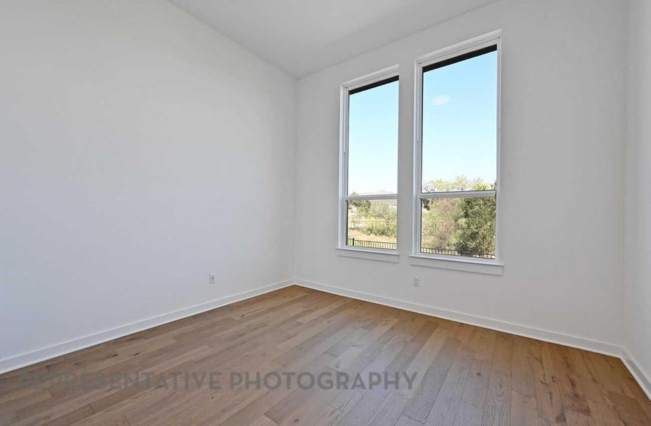Spacious, unfurnished interior of a new home in Meridiana, Manvel (Image 14).