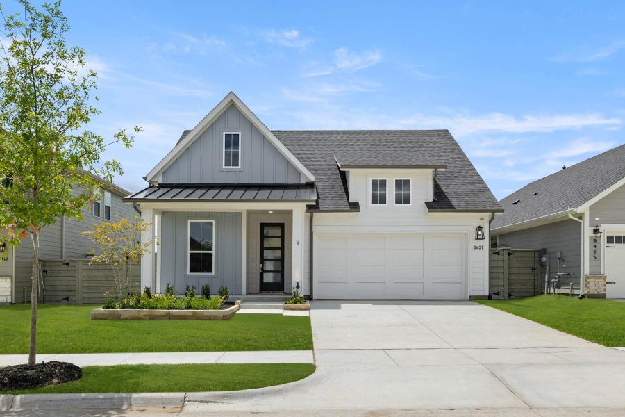 Front exterior of a home in the Landmark community, located in Denton, TX (Image 12).