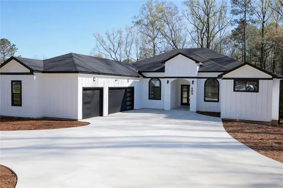 Front exterior of a new home in , Mableton, GA, highlighting curb appeal (Image 1). Front exterior of a new home in , Mableton, GA, highlighting curb appeal (Image 1).