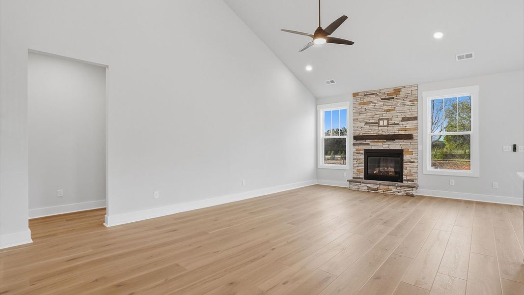 Spacious and stylish family room with two-story ceilings that create a bright and open atmosphere located at Pelham Crossing