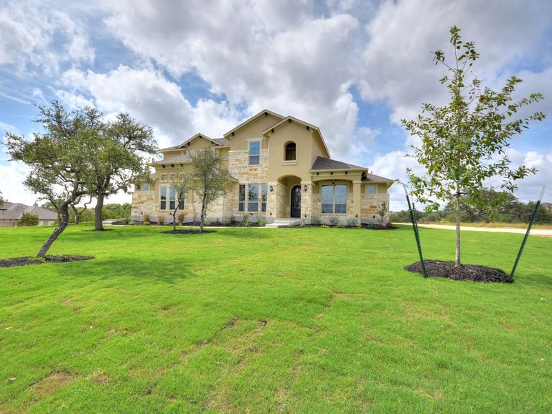 Representative exterior photo of a completed home built from the Madera II by Giddens Homes in Scofield Farms Estates, Georgetown, TX (Image 49).