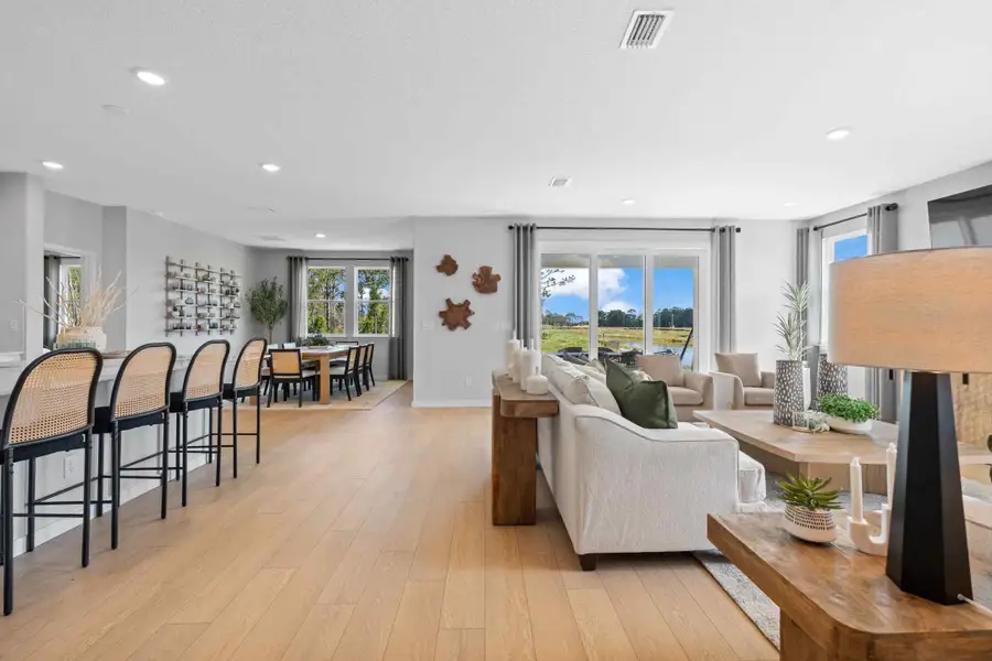 A living room with a wood floor.