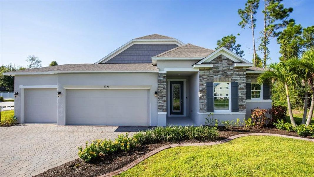 Front exterior of a new home in Spring Hill, Spring Hill, FL, highlighting curb appeal (Image 2). Front exterior of a new home in Spring Hill, Spring Hill, FL, highlighting curb appeal (Image 2).