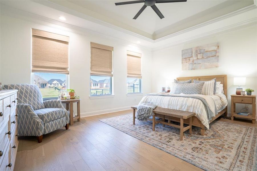 Bedroom with light wood-style flooring, crown molding, a ceiling fan, and recessed lighting Bedroom with light wood-style flooring, crown molding, a ceiling fan, and recessed lighting