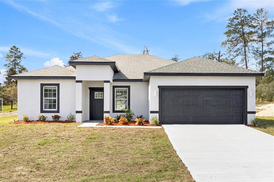 Front exterior of a new home in , Ocala, FL, highlighting curb appeal (Image 1). Front exterior of a new home in , Ocala, FL, highlighting curb appeal (Image 1).