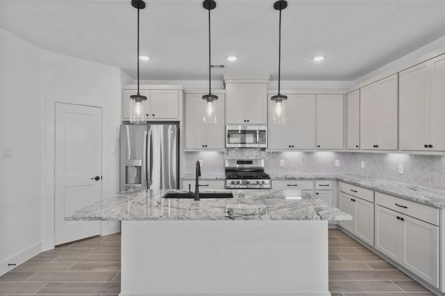 Representative furnished interior of a home built from the Carriagehouse by Chesmar Homes in Meridiana Townhomes, Iowa Colony (Image 7).