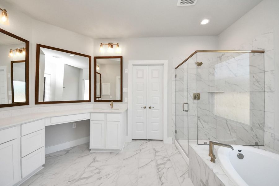Elevate your daily routine at the elegant vanity, now equipped with double sinks, light countertops, modern hardware, and beautiful vanity lights. Elevate your daily routine at the elegant vanity, now equipped with double sinks, light countertops, modern hardware, and beautiful vanity lights.