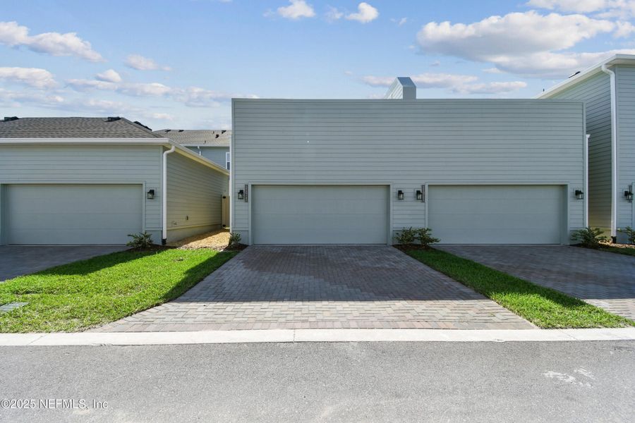 Exterior details and patio area of a home in Seven Pines 24' Rear Entry Townhomes, Jacksonville (Image 18).