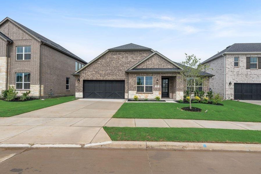 Front exterior of a new home in Sutton Fields, Celina, TX, highlighting curb appeal (Image 2). Front exterior of a new home in Sutton Fields, Celina, TX, highlighting curb appeal (Image 2).