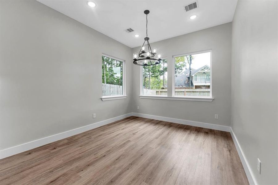 Large primary closet with abundant built-in shelving