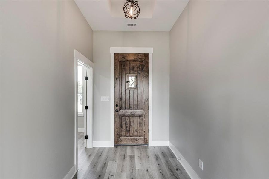 Foyer entrance featuring light hardwood / wood-style floors