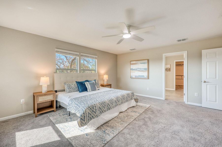 Plentiful natural light fills a spacious bedroom complete with comfortable wall-to-wall carpeting. Plentiful natural light fills a spacious bedroom complete with comfortable wall-to-wall carpeting.