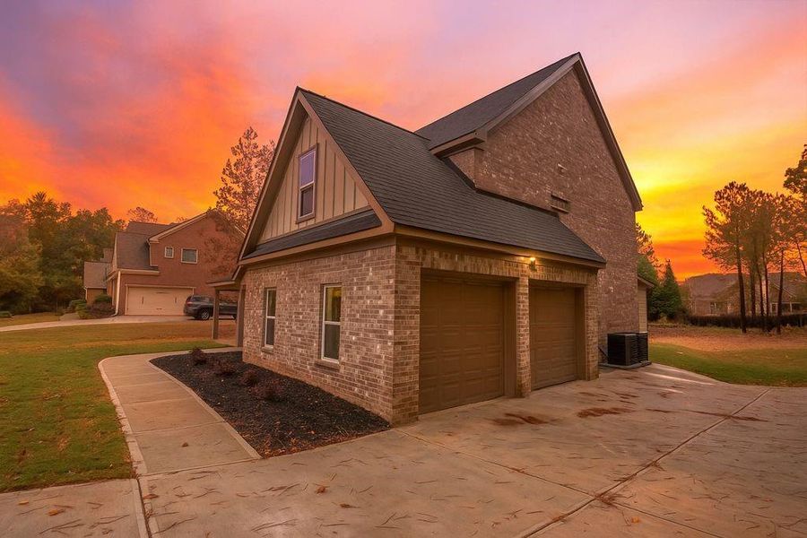 Front exterior of a new home in , Loganville, GA, highlighting curb appeal (Image 1).