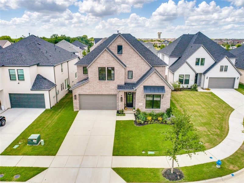 Front exterior of a new home in , McKinney, TX, highlighting curb appeal (Image 2). Front exterior of a new home in , McKinney, TX, highlighting curb appeal (Image 2).