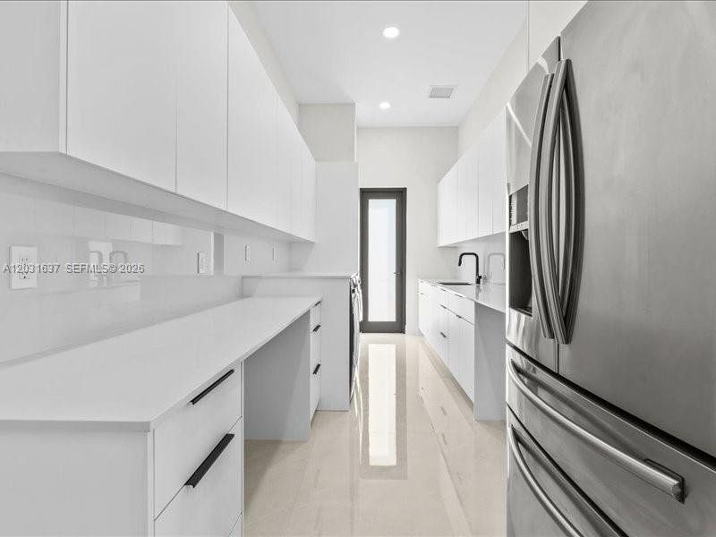 Furnished interior view inside a new home in , Port St. Lucie (Image 11).
