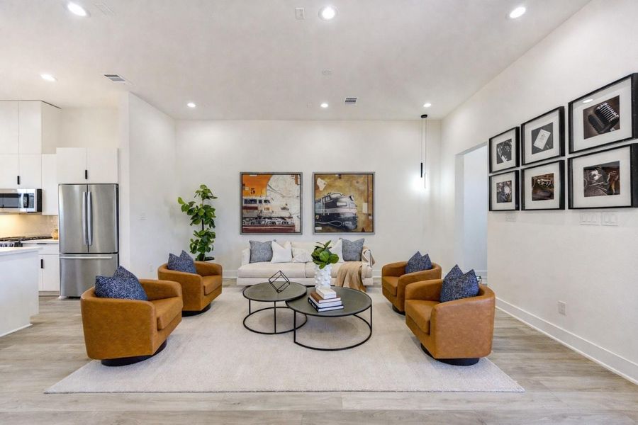 Spacious living area designed for comfort and everyday relaxation. (Refrigerator shown is virtually staged)