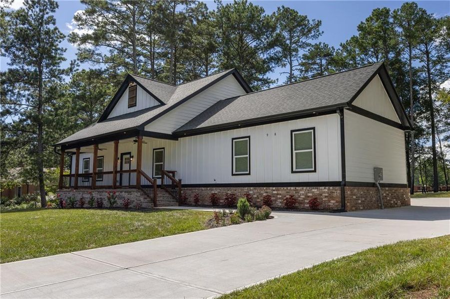 Front exterior of a new home in , Monroe, GA, highlighting curb appeal (Image 22). Front exterior of a new home in , Monroe, GA, highlighting curb appeal (Image 22).