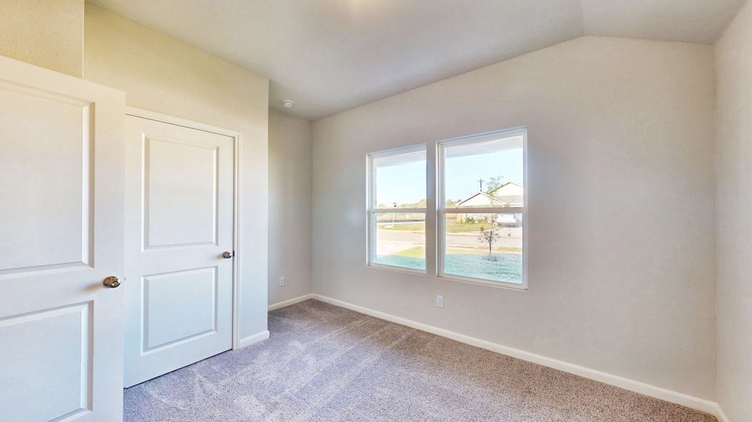 A room with white doors and a window. A room with white doors and a window.