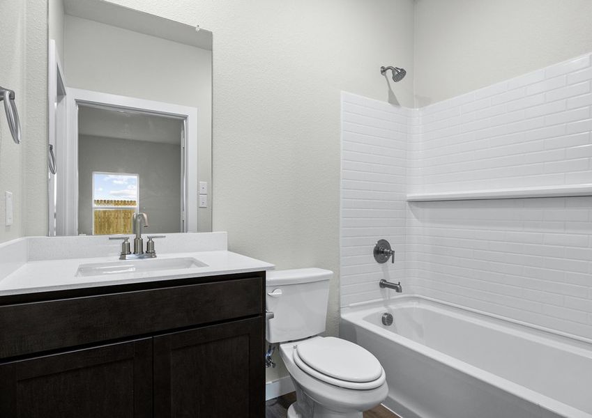 The master bathroom has a vanity and shower-tub combo. The master bathroom has a vanity and shower-tub combo.