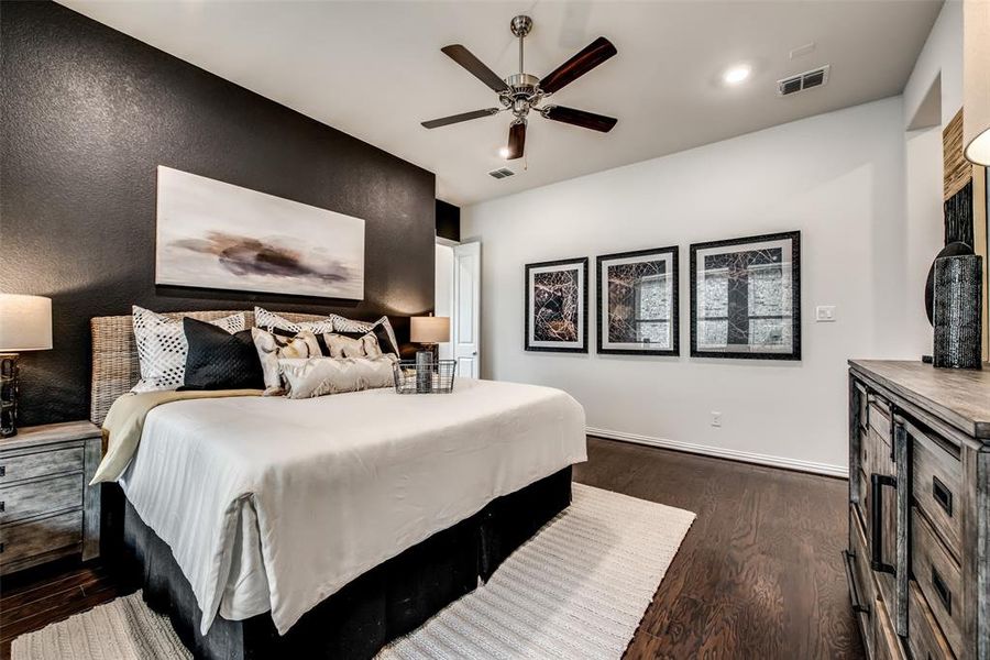 Bedroom with dark wood-style floors, a ceiling fan, and recessed lighting