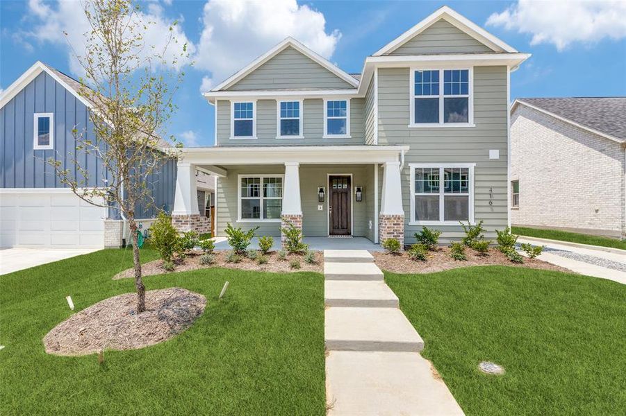 Craftsman house with a garage, covered porch, and a front lawn