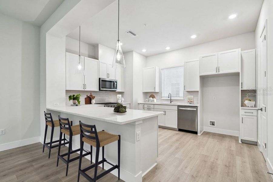 Furnished interior view inside a new home in Towns at Union, St. Petersburg (Image 4).