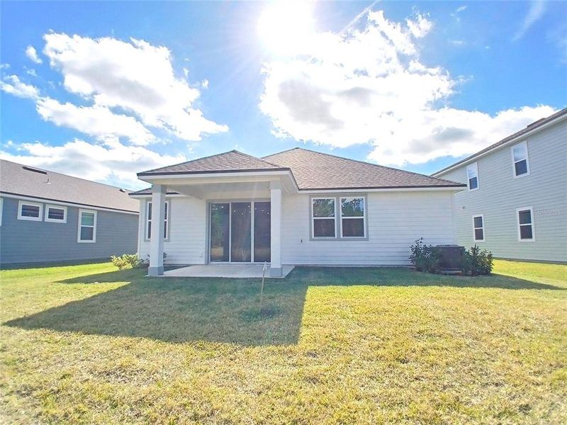 Exterior details and patio area of a home in Magnolia Series at Seminole Palms, Palm Coast (Image 4).