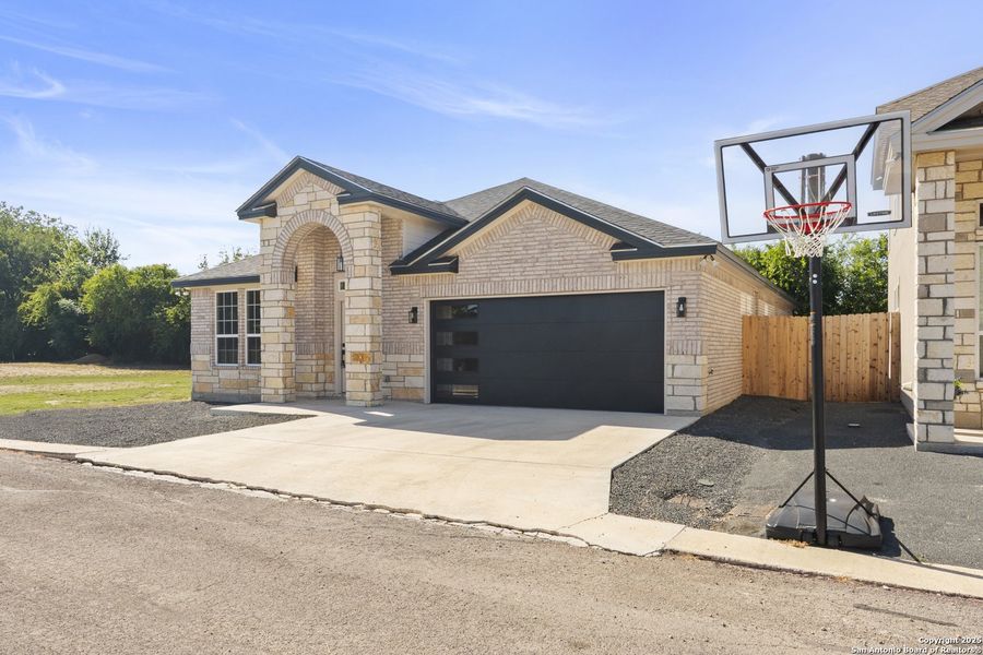 Front exterior of a new home in , Uvalde, TX, highlighting curb appeal (Image 16). Front exterior of a new home in , Uvalde, TX, highlighting curb appeal (Image 16).