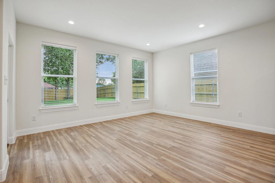 Dining Area featuring recessed lighting, vinyl wood plank floors, and baseboards