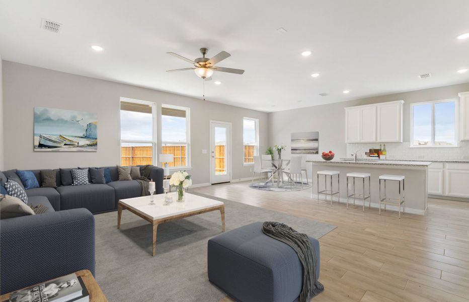 Spacious gathering room with view of kitchen and dining nook