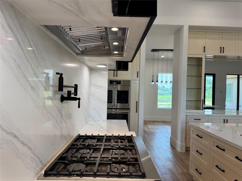 Matching Premium Cafe Series electric double wall oven featuring dual spacious ovens, true convection cooking, intuitive touch controls, and a professional-inspired stainless steel design. French-door upper oven opens both oven doors simultaneously by pulling a single handle