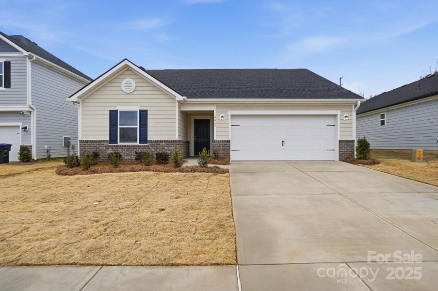 Front exterior of a new home in Wilson Creek, Indian Land, SC, highlighting curb appeal (Image 1). Front exterior of a new home in Wilson Creek, Indian Land, SC, highlighting curb appeal (Image 1).