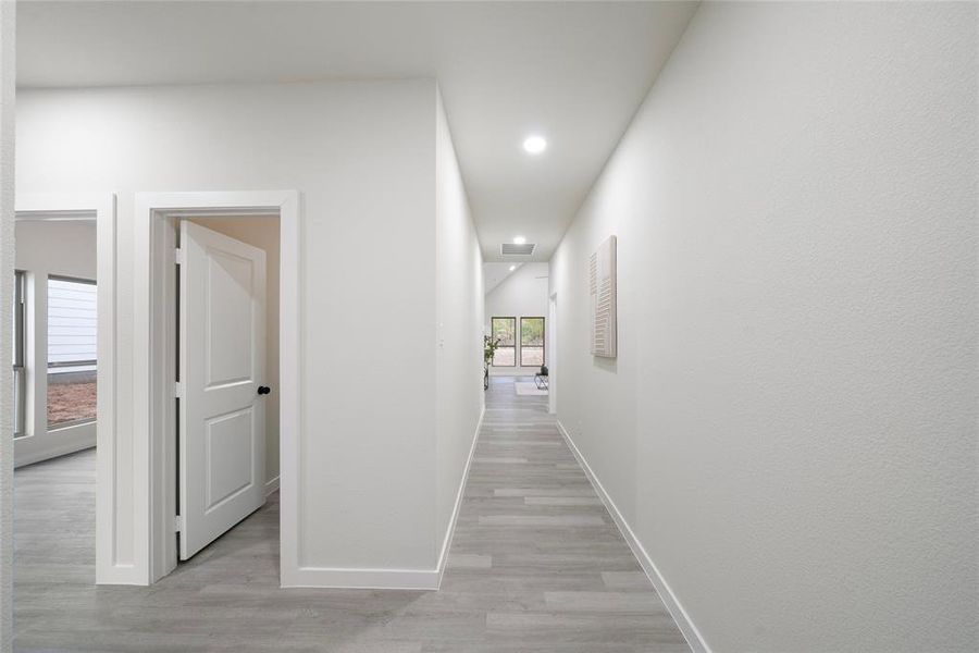 Hallway featuring light hardwood / wood-style flooring