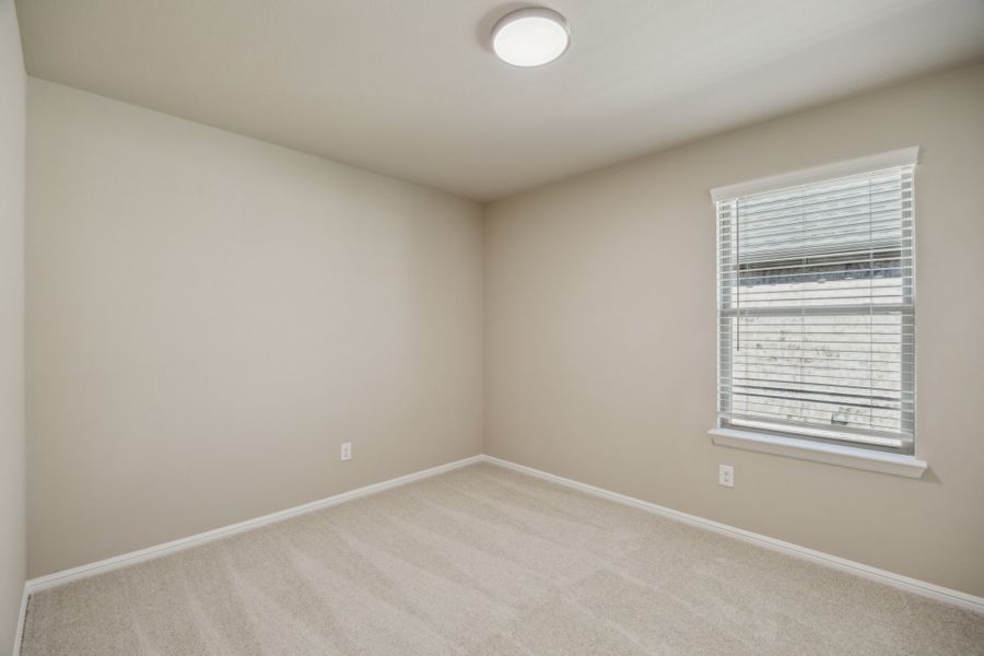 Bedroom in the Harper home plan by Trophy Signature Homes – REPRESENTATIVE PHOTO