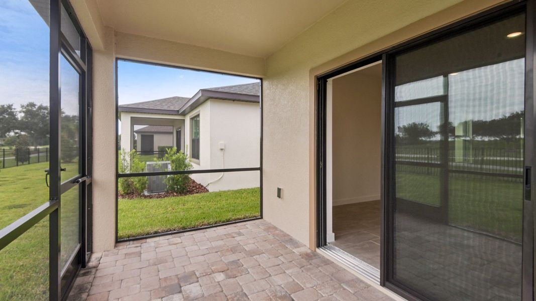 Exterior details and patio area of a home in Grasslands West, Lakeland (Image 21).